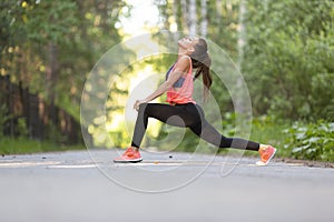 Woman stretching muscles outdoor. Sport and healthy lifestyle concept.