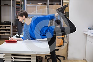 woman stretching in the office