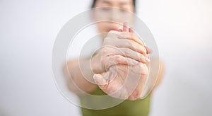 Woman stretching their arms to relax and be flexible while doing exercise in their home.