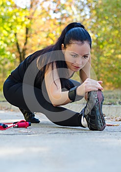 Woman stretching before training