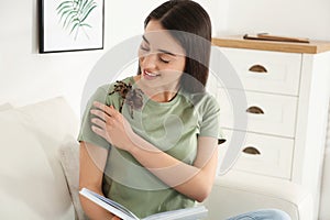 Woman with striped knee tarantula. Exotic pet