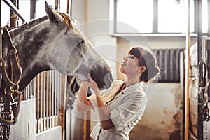 Woman stroking the horse