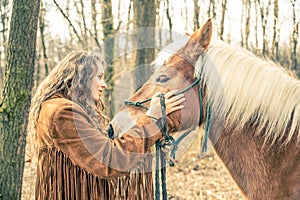 Woman stroking horse