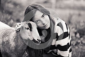 Woman is stroking a sheep