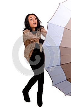 Woman struggling with an umbrella