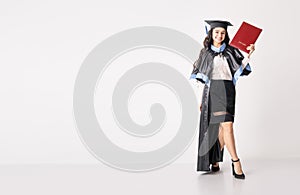 Woman student with diploma on white background with copy space.