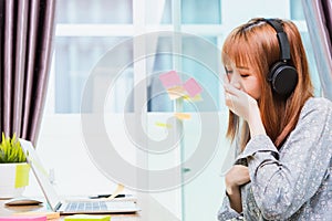 Woman, student girl tired sleepy yawning use hand close mouth during working with laptop computer at home office