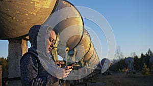 Woman student operator of institute of Solar Terrestrial Physics monitors communication equipment in mobile. Unique