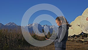 Woman student operator of institute of Solar Terrestrial Physics monitors communication equipment in notebook. Unique