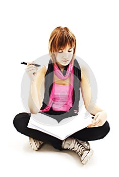 Woman student sitting thinking while studying