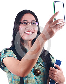 Woman student taking picture with her handphone