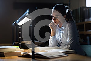 Woman studying late at night