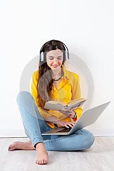 Woman studying and listening to headphones