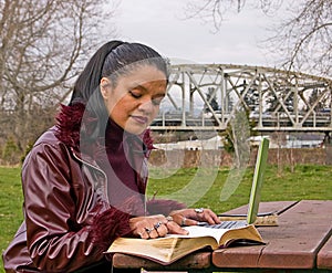 Woman Studying at Park with Laptop Computer