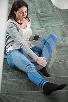 woman stumble in office steps