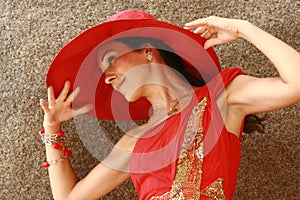 Woman with stunning big red hat