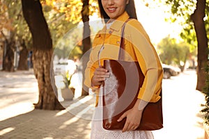 Woman with stylish shopper bag outdoors, closeup