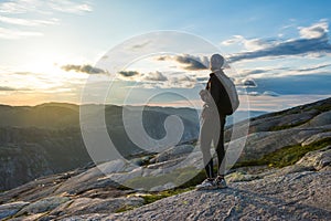 Woman successful hiking silhouette in mountains, motivation and inspiration in sunset