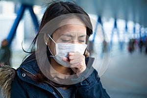 Woman suffer from cough with face mask protection photo