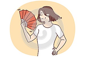 Woman suffer from heatstroke use hand fan