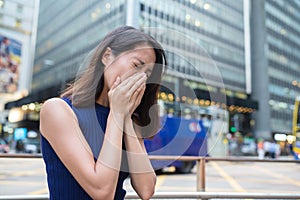 Woman suffer from nose allergy due to air pollution