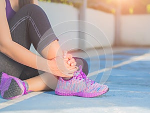 Woman suffering from an ankle injury.