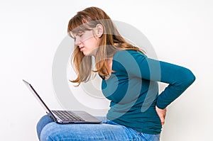 Woman is suffering from back pain - bad posture concept