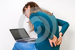 Woman is suffering from back pain - bad posture concept