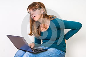 Woman is suffering from back pain - bad posture concept