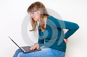 Woman is suffering from back pain - bad posture concept