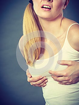 Woman suffering from breast pain
