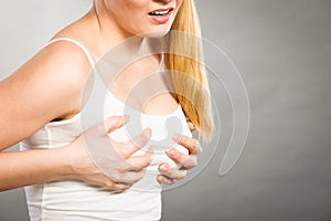 Woman suffering from breast pain photo