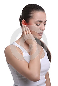 Woman suffering from ear pain on white background