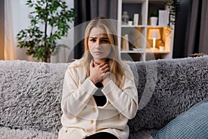 Woman suffering from flu at home
