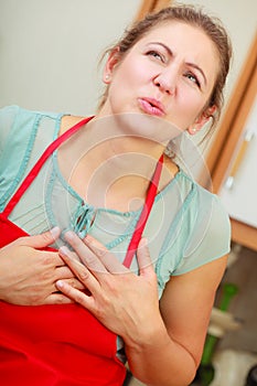 Woman suffering from having heart attack.