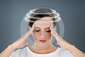 Woman Suffering From Headache Dizziness photo