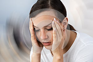 Woman Suffering From Headache Dizziness photo