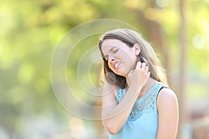 Woman suffering itching scratching neck