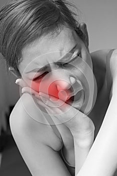 Woman suffering from jaw pain, toothache, tooth sensitivity