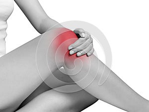 Woman suffering from knee pain, joint pains. mono tone highlight