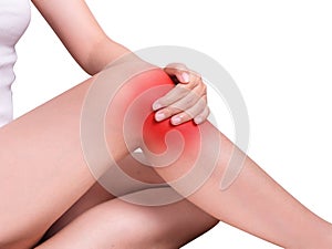 Woman suffering from knee pain, joint pains. red color highlight photo