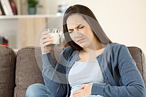 Woman suffering lactose intolerance photo
