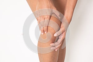 Woman suffering from leg pain, calf pain. mono tone highlight at calf, leg isolated on white background.