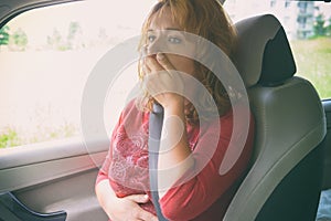 Woman suffering from motion sickness