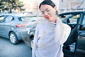 Woman suffering neck pain after car accident pile-up