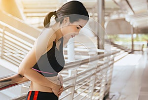 Woman suffering from pain and colic is a frequent problem after sport exercise running jogging and workout