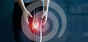 Woman suffering from pain in knee, Injury from workout and osteoarthritis, Tendon problems and Joint inflammation on dark