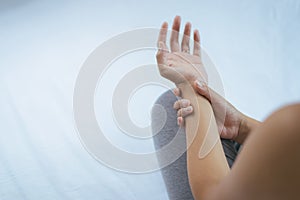 Woman suffering with parkinson`s disease symptoms,Selective focus hands