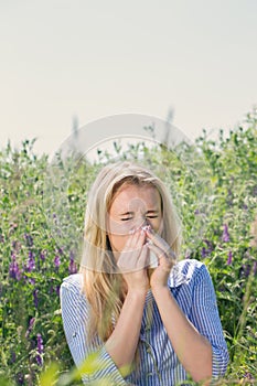 Woman suffering from seasonal allergies