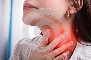 Woman Suffering From Sore Throat